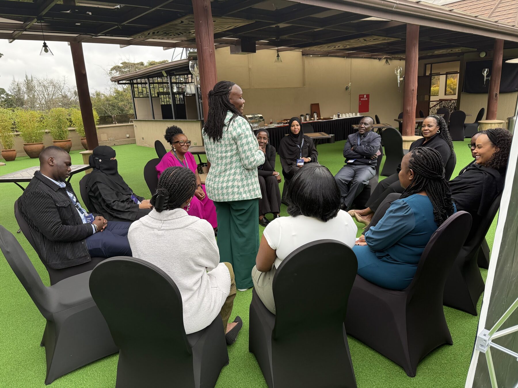 Vongai Nyahunzvi facilitating a circle discussion with a leadership cohort